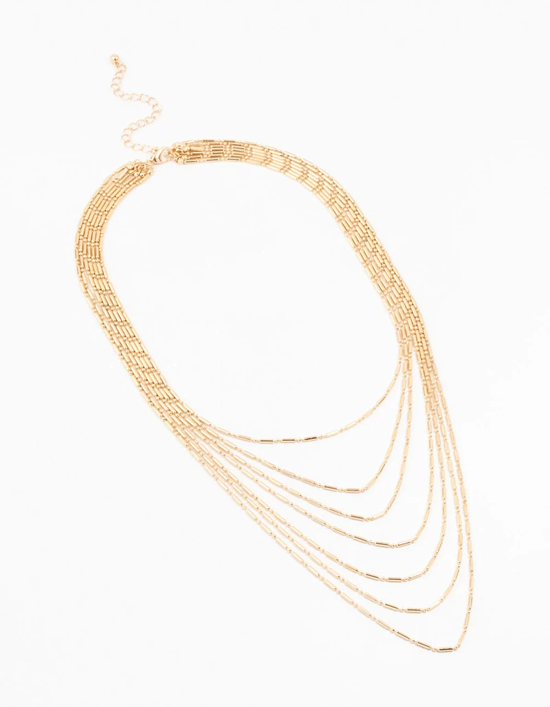 Collier en or superposé