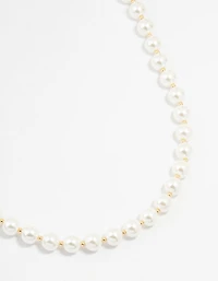 Collier plaqué or alternant perles moyennes et perles rondes