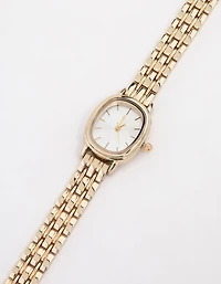 Petite montre ovale en or