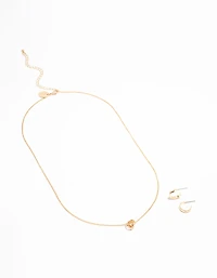 Collier pendentif mini sphère en or et ensemble de boucles d’oreilles en forme de cerceau élégantes