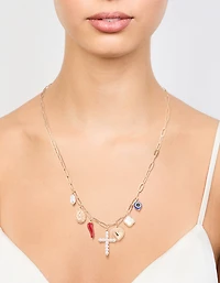 Croix en or et collier à charmes chili