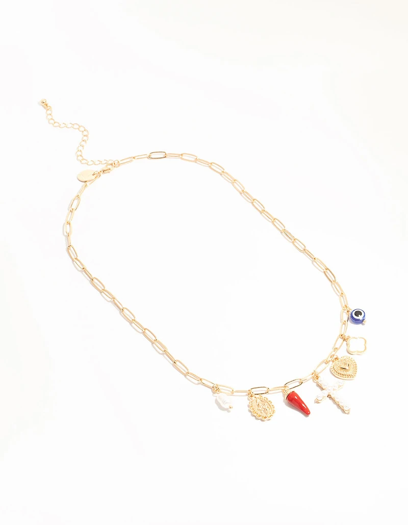 Croix en or et collier à charmes chili
