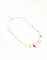 Croix en or et collier à charmes chili