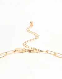 Croix en or et collier à charmes chili