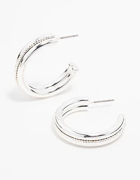 Boucles d’oreilles en cerceau en argent torsadé au centre