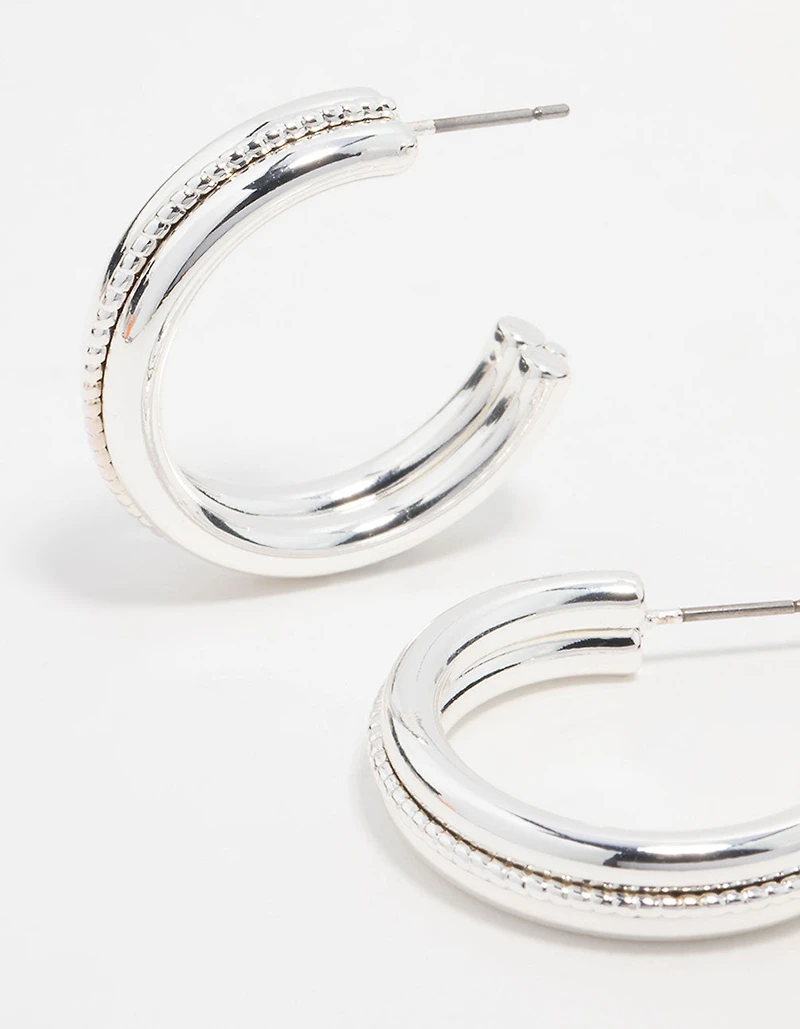 Boucles d’oreilles en cerceau en argent torsadé au centre