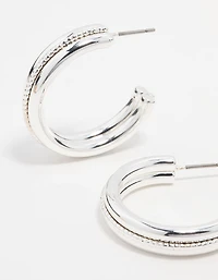 Boucles d’oreilles en cerceau en argent torsadé au centre