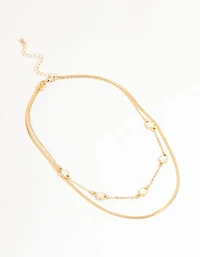 Collier en couches de fleurs dorées