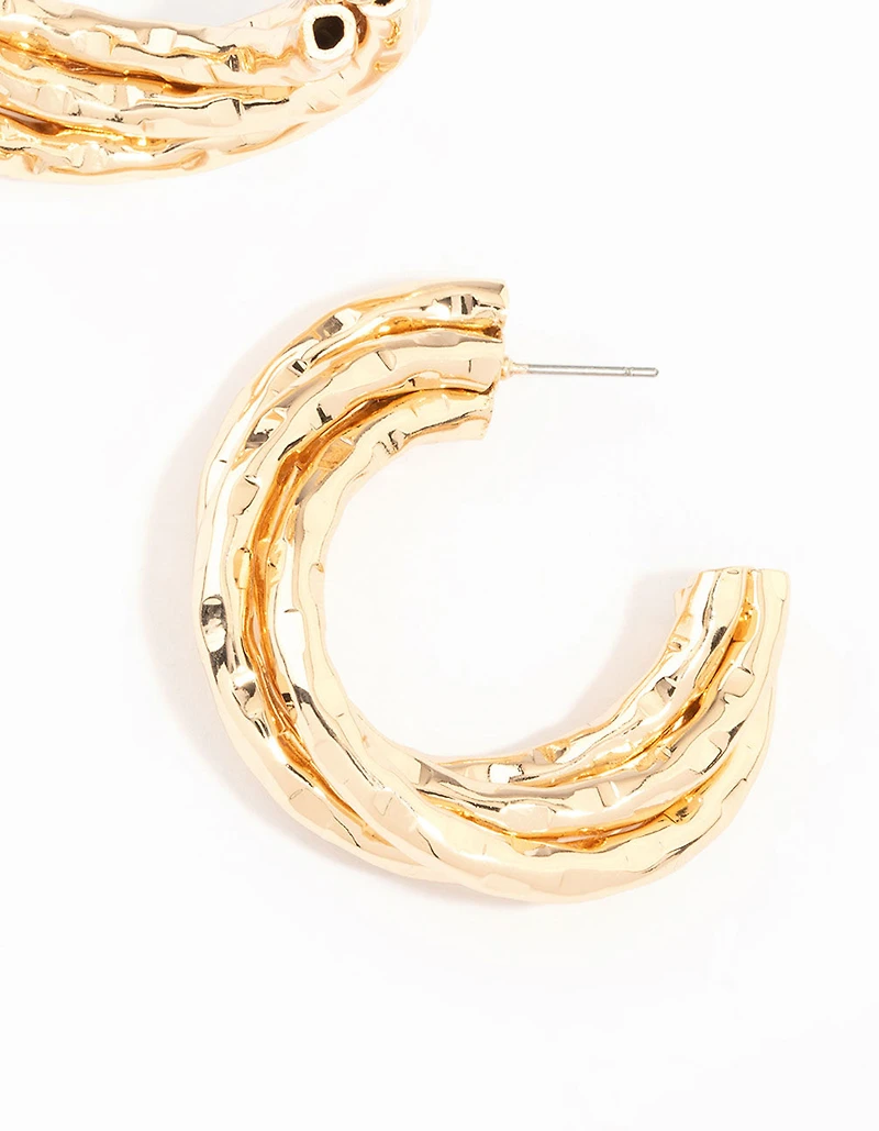 Boucles d’oreilles en anneau torsadé en or en fusion