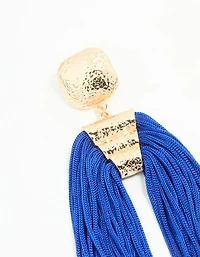 Boucles d’oreilles pendantes en or à grands pompons