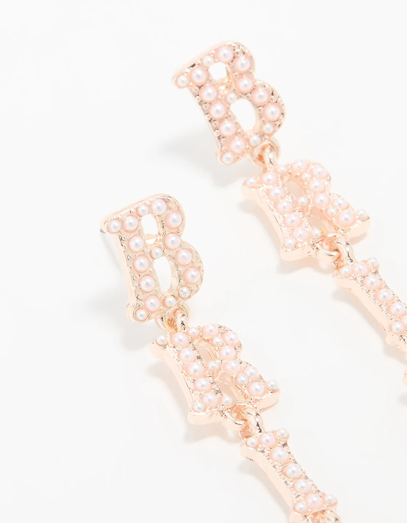 Boucles d’oreilles tombantes mariée en or rose