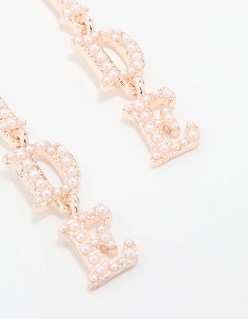 Boucles d’oreilles tombantes mariée en or rose