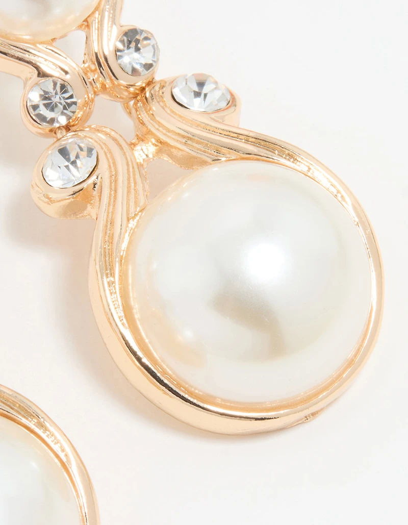 Boucles d’oreilles tombantes en perle dorée Diamante