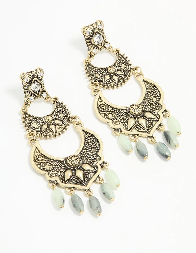 Boucles d’oreilles pendantes anciennes texturées de perles dorées
