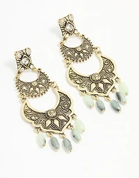 Boucles d’oreilles pendantes anciennes texturées de perles dorées