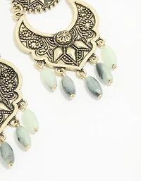 Boucles d’oreilles pendantes anciennes texturées de perles dorées