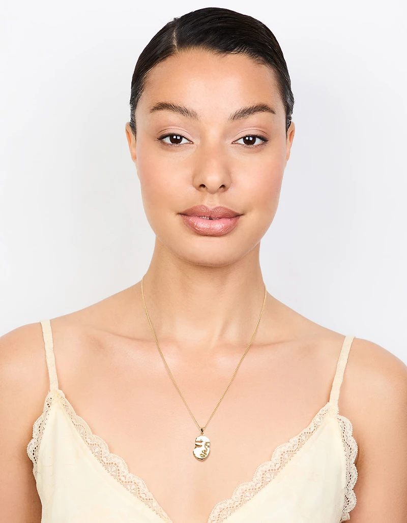 Collier pendentif avec visage en or
