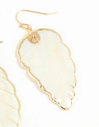 Boucles d’oreilles tombantes en feuille de coquillage authentique en or