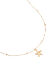 Collier pendentif étoile de mer doré texturé