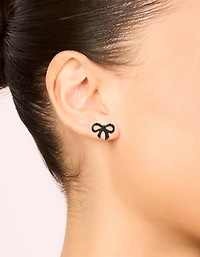 Boucles d’oreilles à ruban en métal noir avec nœud et clous