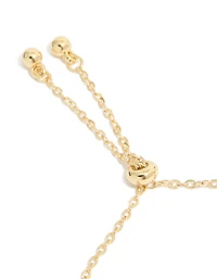 Bracelet à bascule papillon et cœur en zircone cubique plaqué or