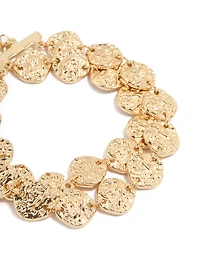 Bracelet à disque en or martelé et superposé