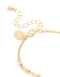 Gold Plated Beaded Cross Lariat Bracelet