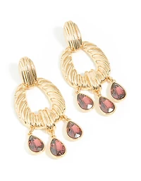 Boucles d’oreilles pendantes dorées et mini diamants rouges