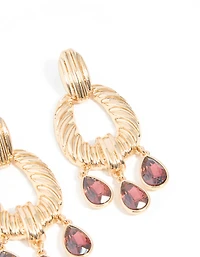 Boucles d’oreilles pendantes dorées et mini diamants rouges