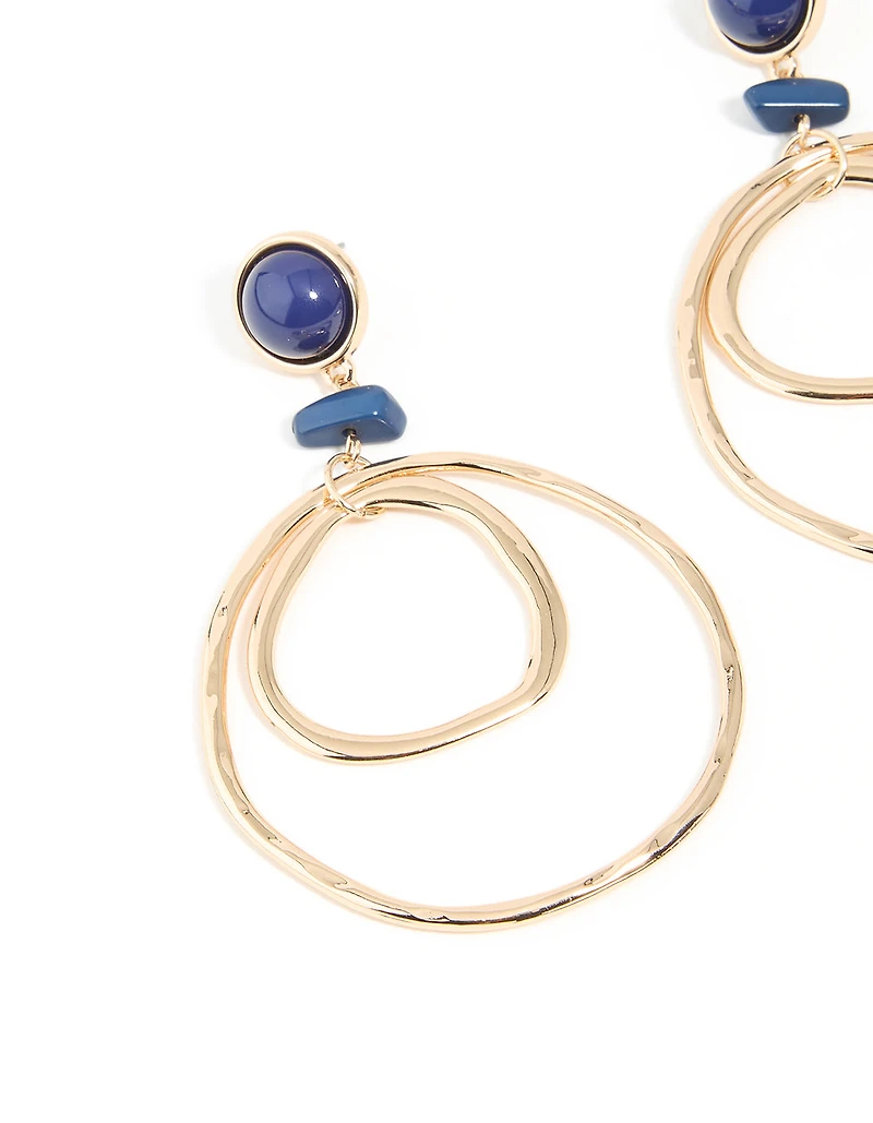 Boucles d’oreilles à double cerceau en pierre bleue dorée