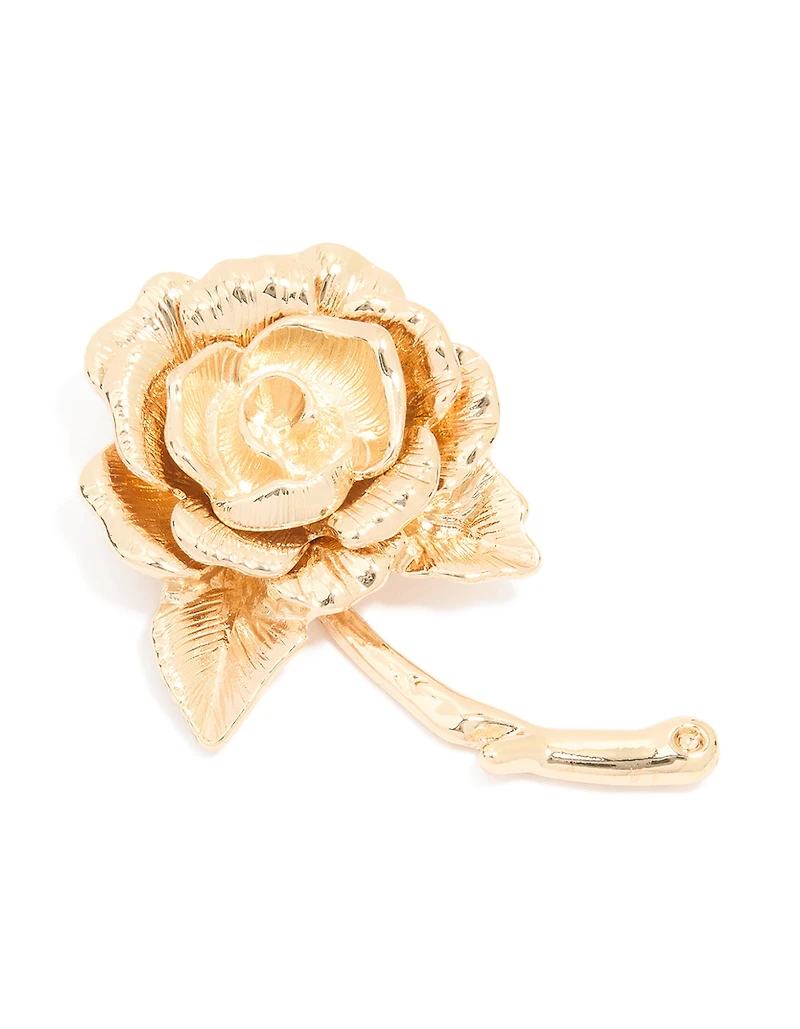 Broche en rose dorée qui fleurit