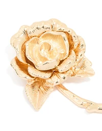 Broche en rose dorée qui fleurit