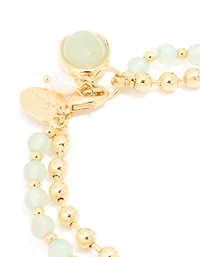 Bracelet en couches à pierres semi-précieuses vertes plaquées or avec perles et boule