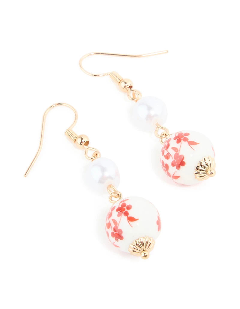 Boucles d’oreilles pendantes peintes en porcelaine dorée rouge perle et blanc