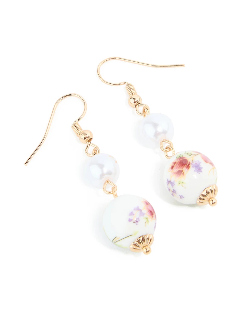 Boucles d’oreilles tombantes en fleurs peintes en porcelaine en or perlé et violette