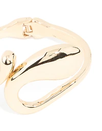 Bracelet à charnière tourbillonnante irrégulière dorée