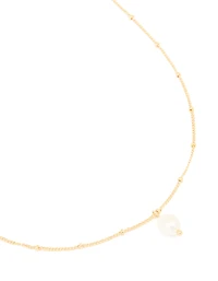 Pendentif en perles d’eau douce plaquées or et collier à boule