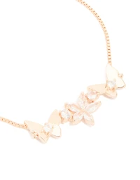 Bracelet à fermoir à bascule plaqué or rose avec zircon cubique, motif fleur et papillon