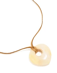 Pendentif en pierre crème, collier à cordon brun