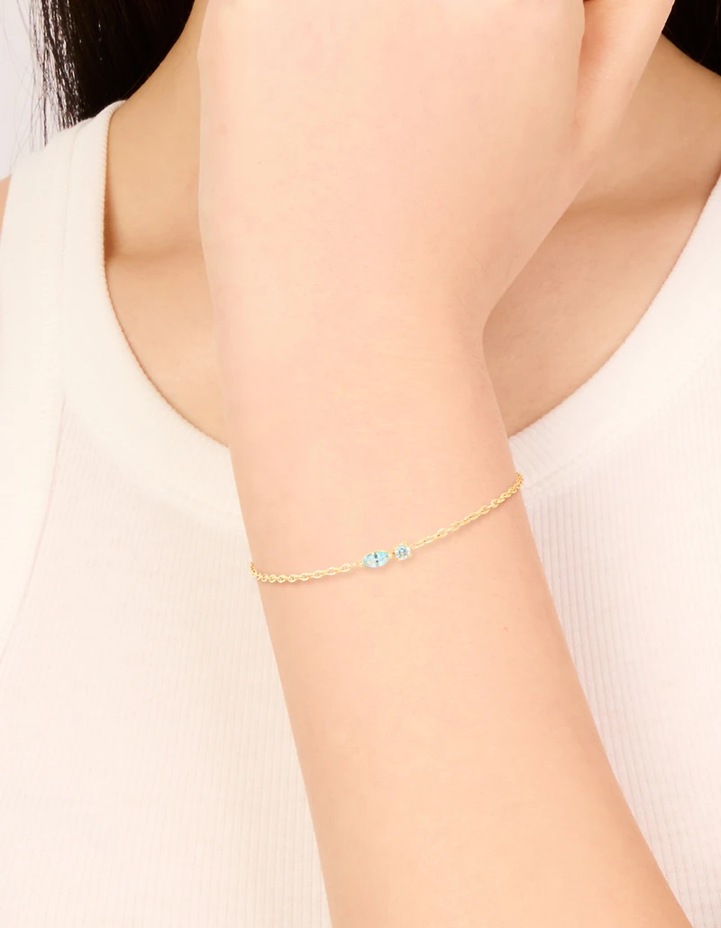 Bracelet de pierre de naissance en zircone cubique bleu clair en acier inoxydable imperméable plaqué or