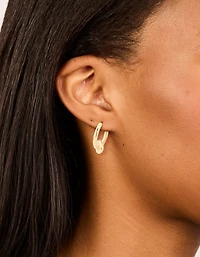 Boucles d’oreilles classiques Huggie nouées en laiton doré