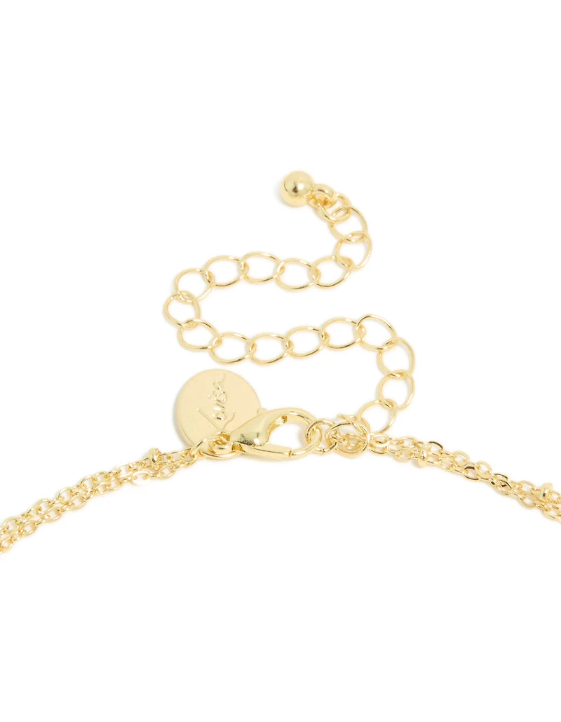 Baguette cubique en zircone émeraude plaquée or et collier superposé de gouttelettes