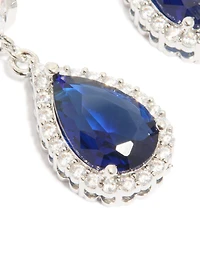 Boucles d’oreilles cubiques en zircone en forme de poire en zircone bleu saphir argenté