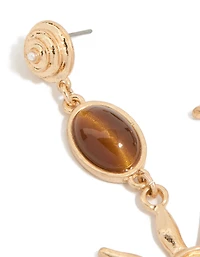 Boucles d’oreilles en pierre brun dorée et grandes gouttes de soleil tourbillonnantes