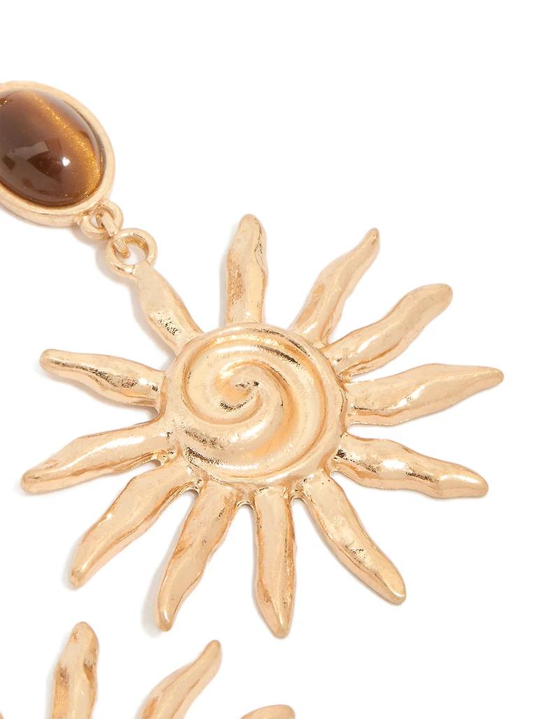 Boucles d’oreilles en pierre brun dorée et grandes gouttes de soleil tourbillonnantes