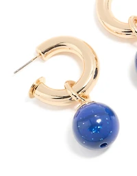 Boucles d’oreilles petites perles ouvertes dorées et bleues