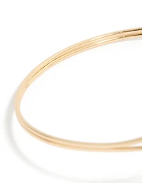 Étoile de mer dorée et manchette de bras en coquillage