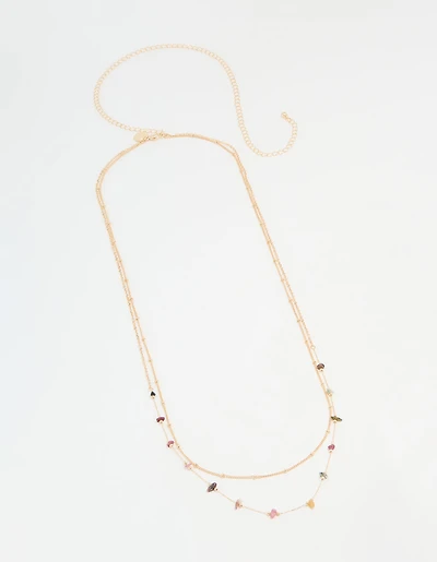Chaîne de taille en pierres semi-précieuses multicolores dorées.