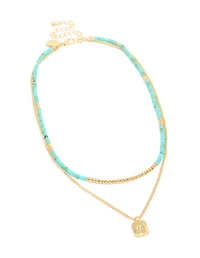 Collier à perles bleues plaquées or et pendentif céleste en couches