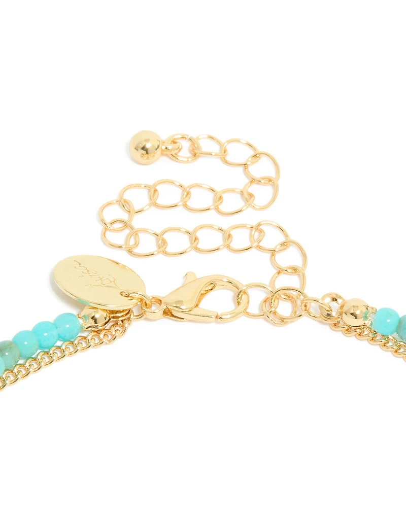 Collier à perles bleues plaquées or et pendentif céleste en couches